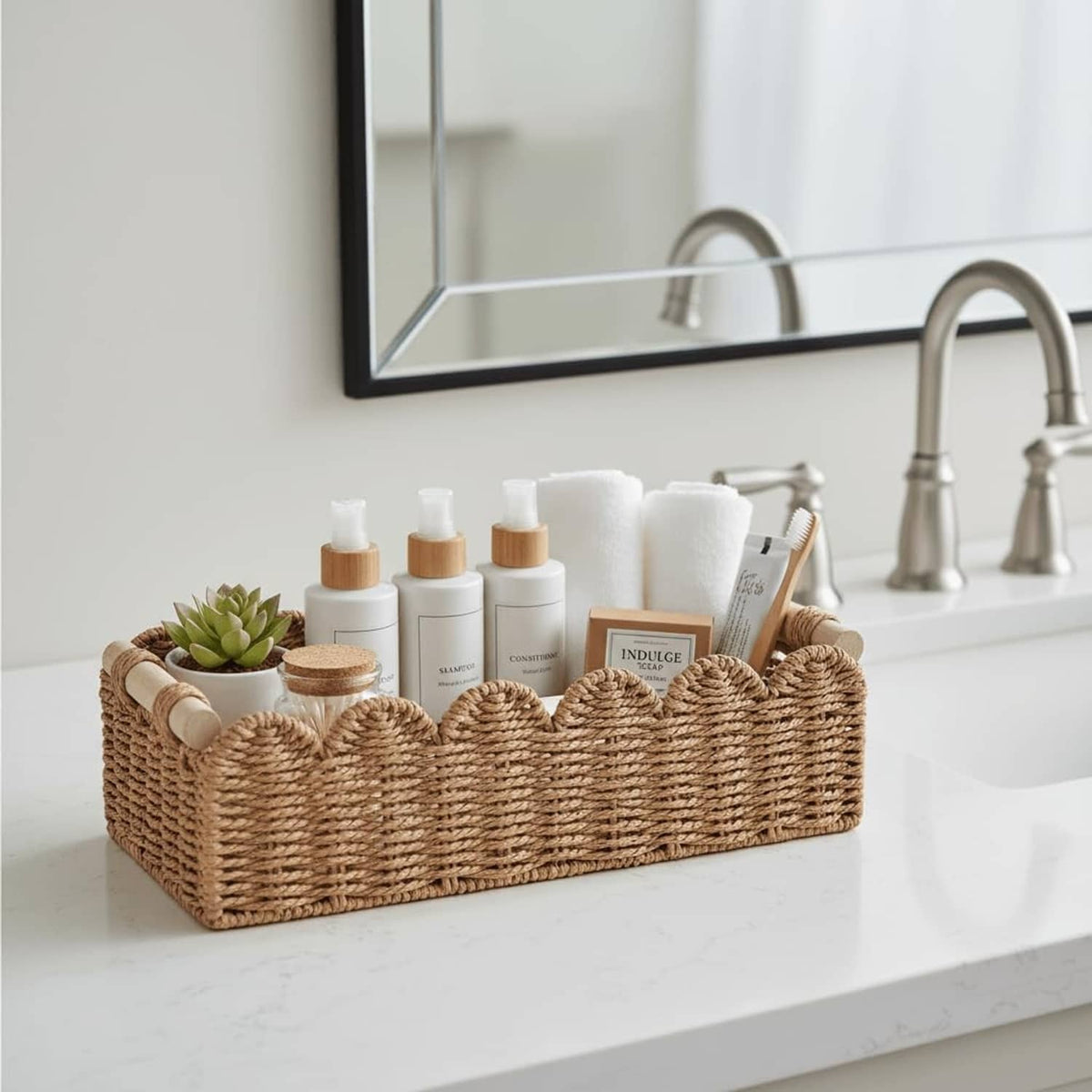Scalloped woven rattan toilet paper basket with bottles and rolled tissue