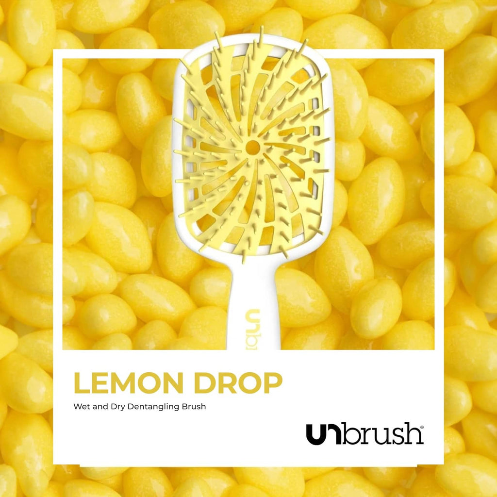 UNbrush Lemon Drop wet and dry detangling brush with white handle and yellow bristles