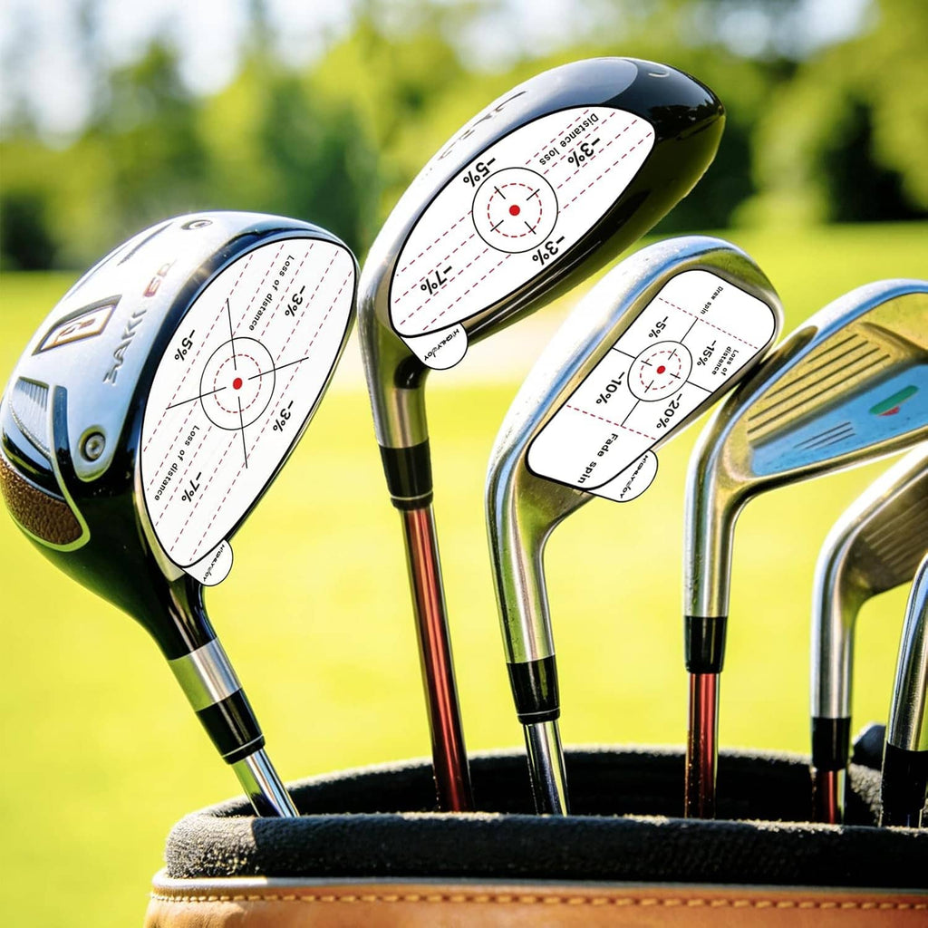 Set of golf clubs with white impact target stickers on club faces