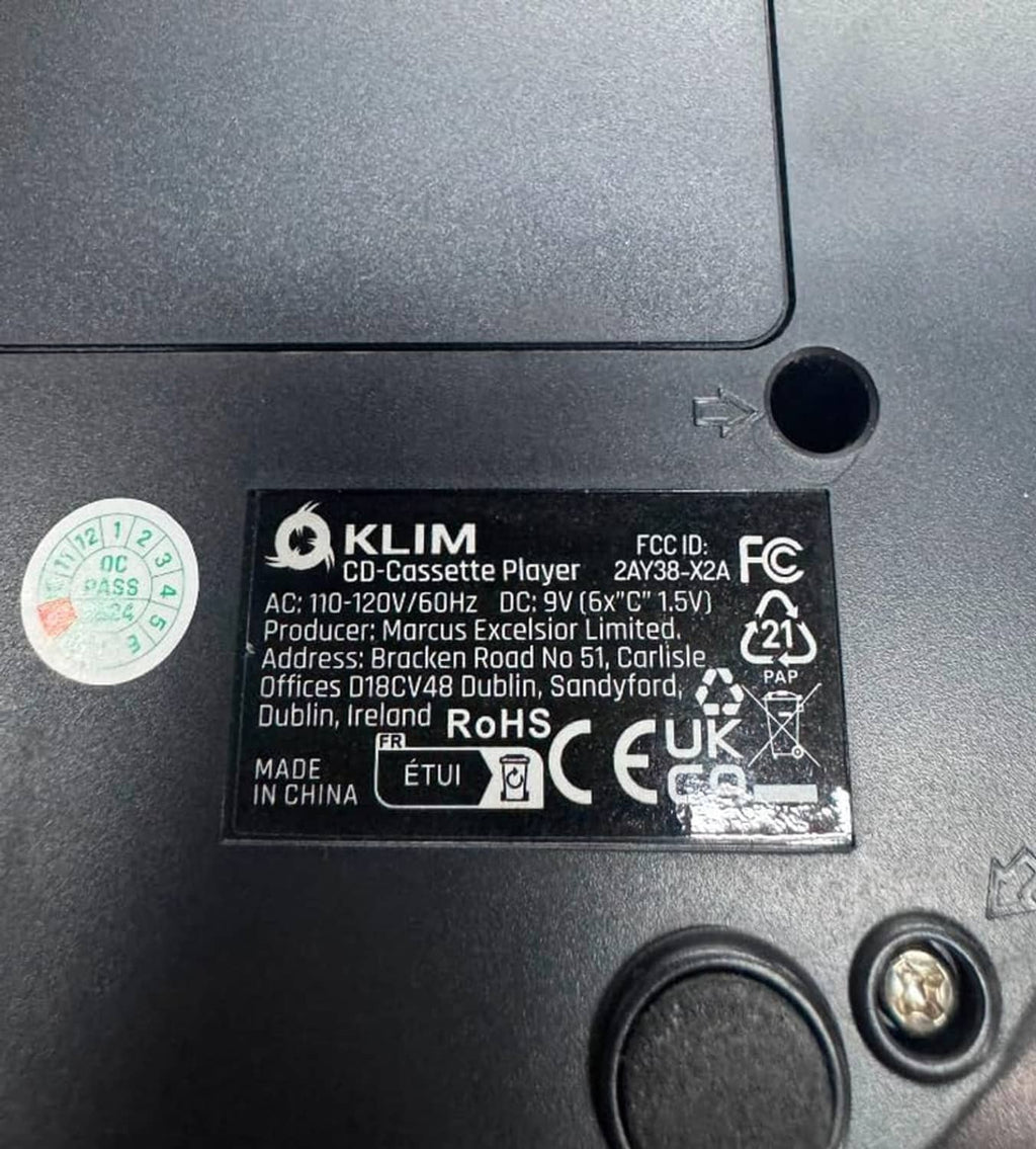 Black CD cassette boombox housing label with compliance and product specs.