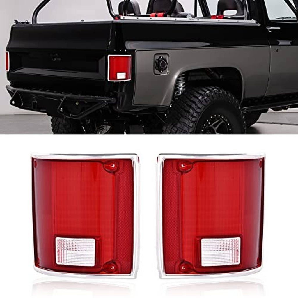 Two red tail lights with white rectangular reflectors in chrome-trimmed housings.