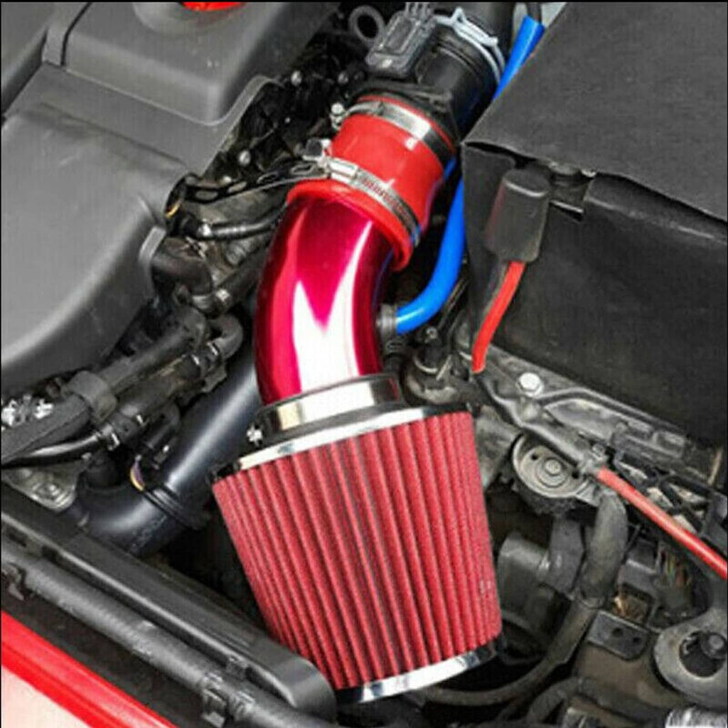 Close-up of installed cold air intake: red cone air filter, red pipe, blue silicone hose