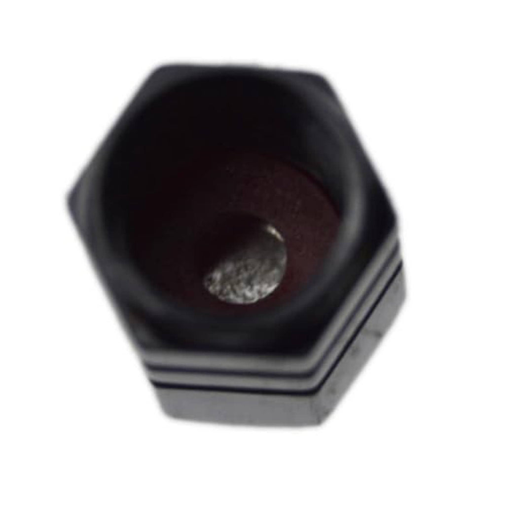 Black valve stem cap interior, showing metal insert and threaded opening