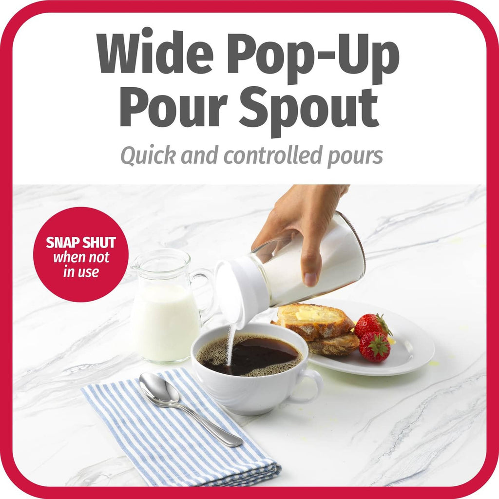 Glass sugar pourer with wide pop-up spout dispensing into coffee