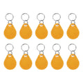Set of yellow RFID key fobs with metal key rings and rounded fob bodies