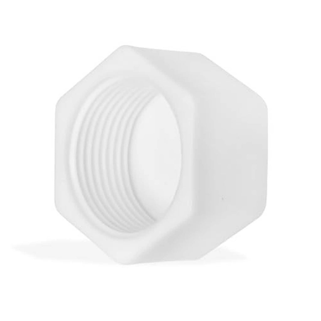 White PVC pipe end cap showing internal threading on hex plug