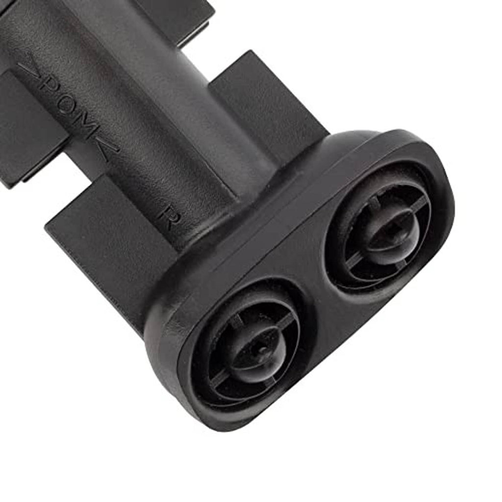 Black plastic headlight washer nozzle jet sprayer close-up of dual circular outlet nozzles