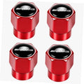Red metal tire valve stem cap with AMG logo oval insert, polished finish