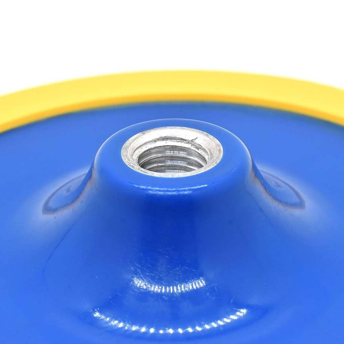 Blue sanding pad hub with metal threaded insert and yellow rim, close-up.
