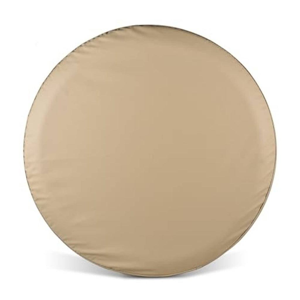 Beige spare tire cover with smooth round surface and stitched perimeter.