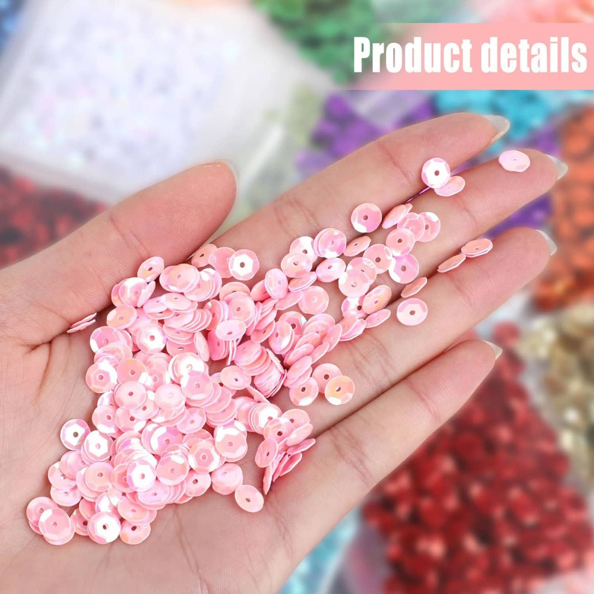 Pink iridescent round cup sequins on hand, glossy reflective craft sparkle pieces