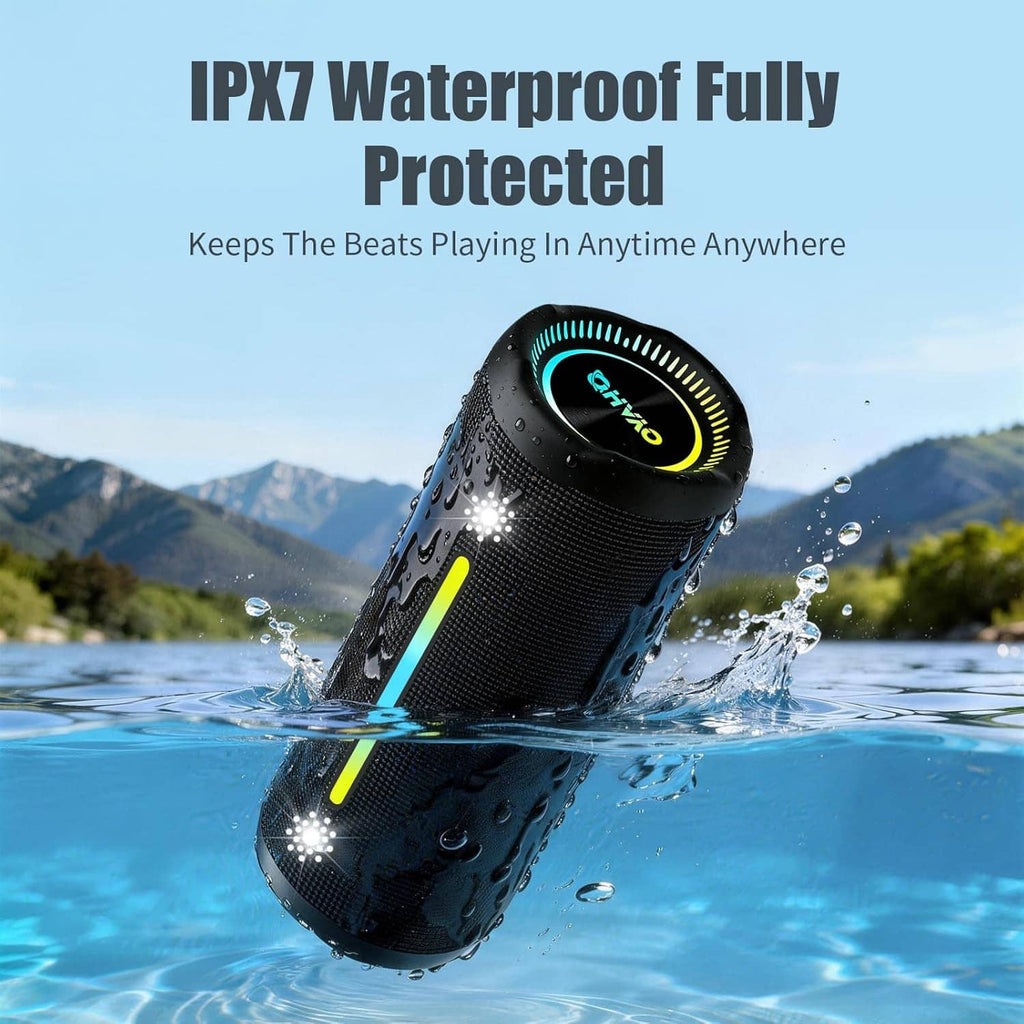 Black cylindrical wireless Bluetooth speaker with water droplets and glowing RGB accent light