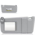 Left driver-side sun visor in light gray fabric with label on outer face