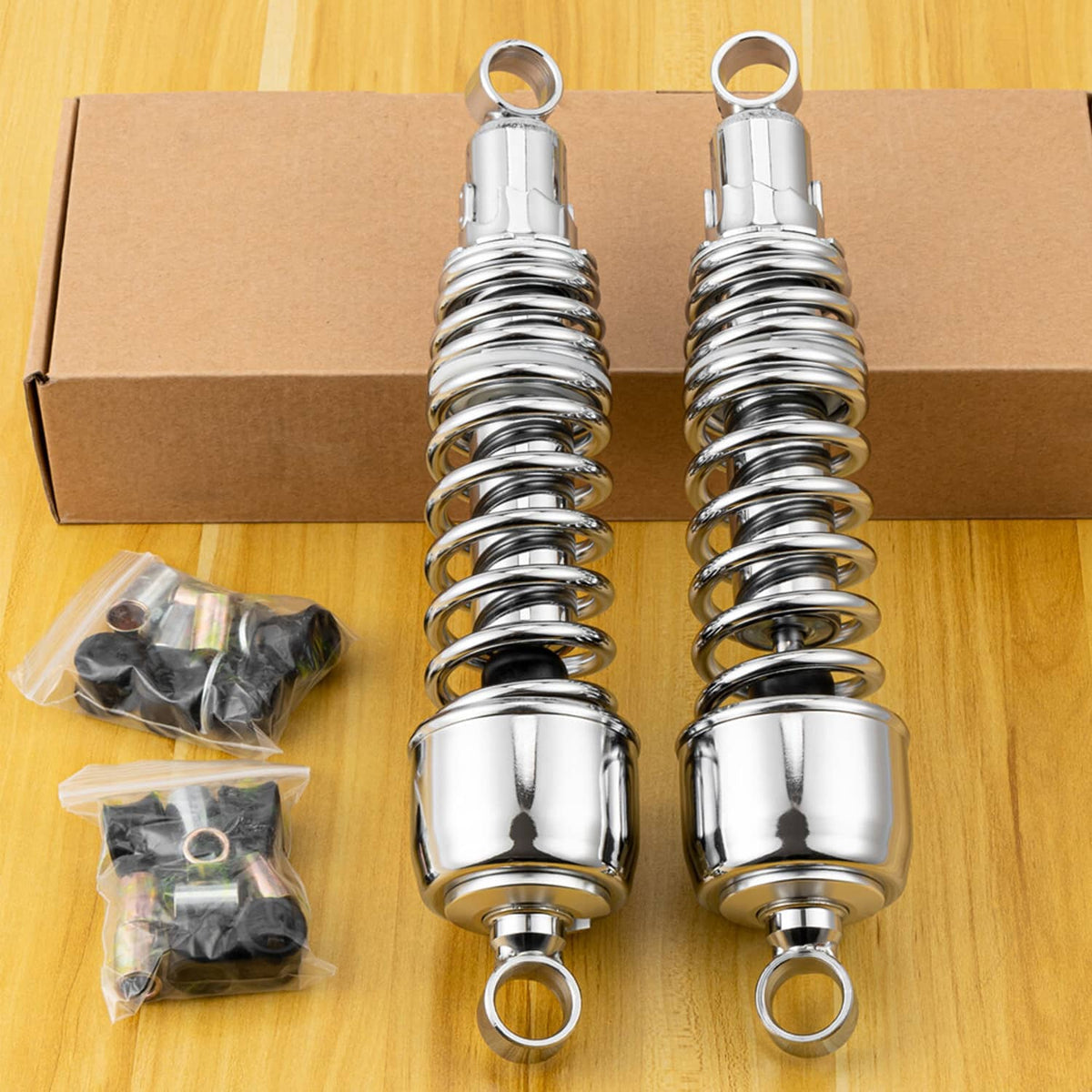 Pair of 13-inch chrome rear motorcycle shocks with mounting rings and coil springs