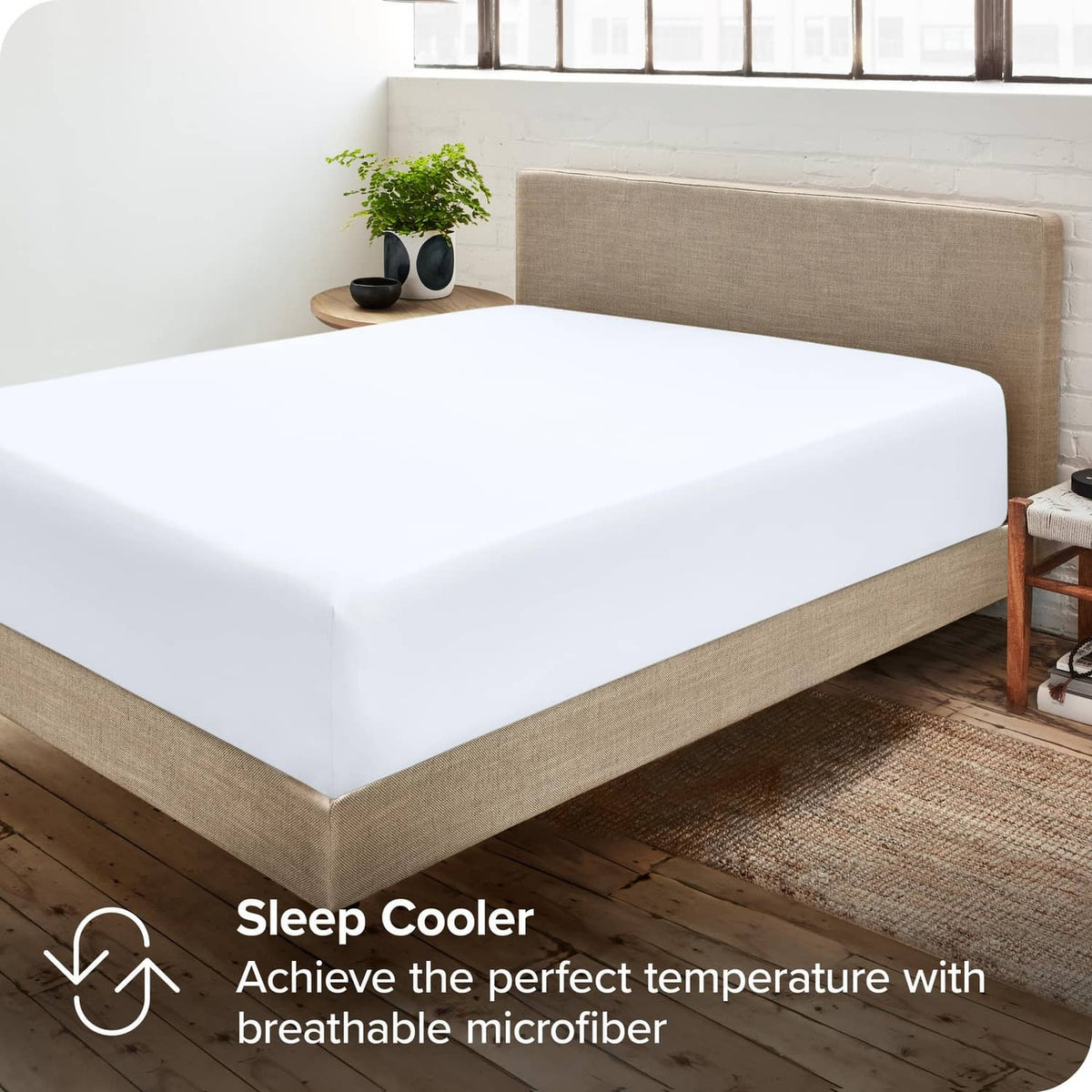 White fitted sheet on bed with neatly fitted corners and soft microfiber surface