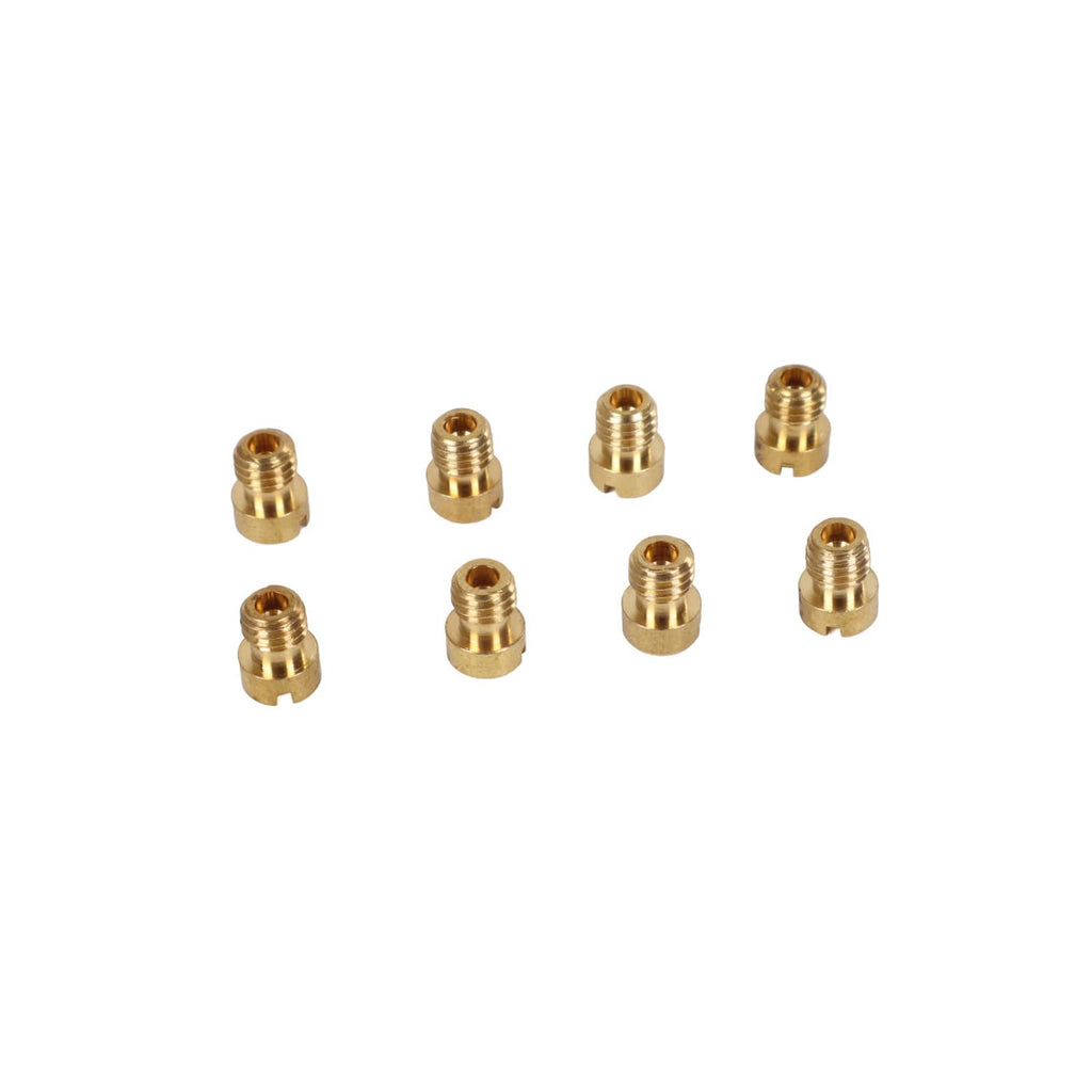 Set of brass carburetor jet fittings on white background