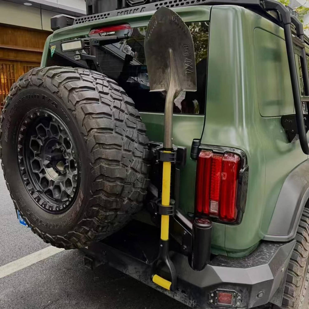 Black shovel holder rubber grip mount clamp installed on vehicle side rail