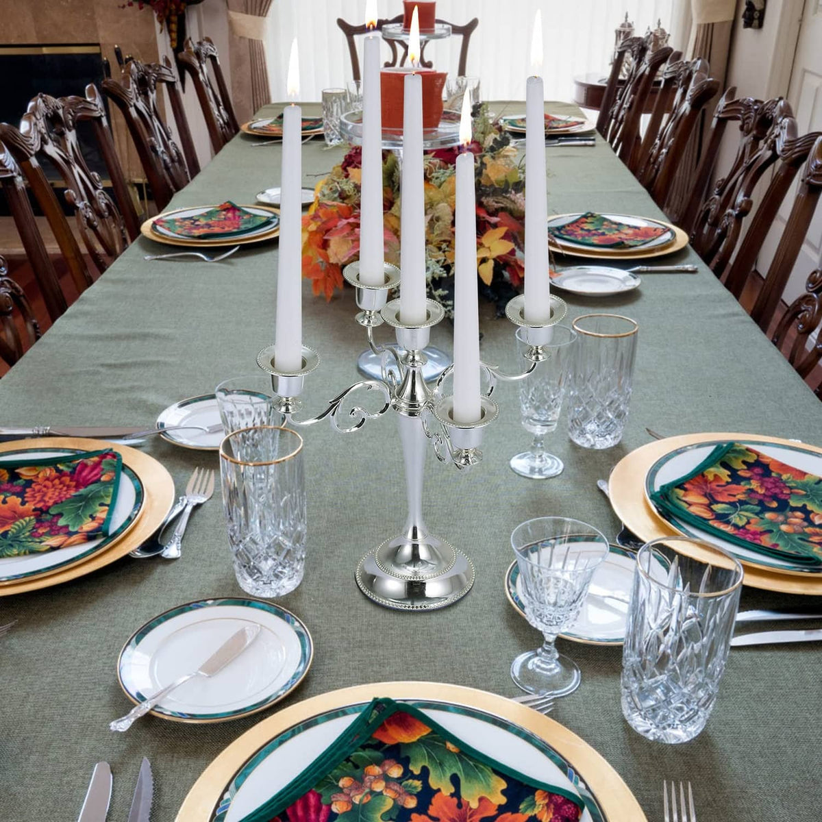 White taper candles on dining table, unlit, slim 10-inch tapers