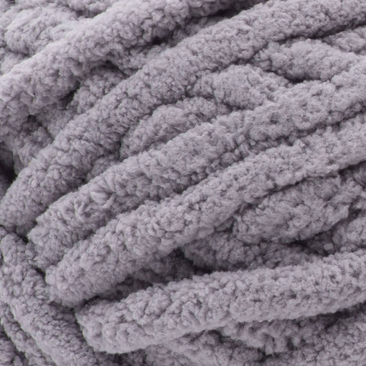 Close-up of gray chenille-style yarn with thick ribbed loop texture