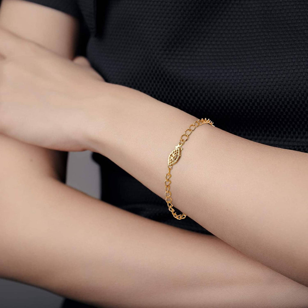 Gold tone oval filigree bracelet-style clasp with pearl-look center and fish hook end