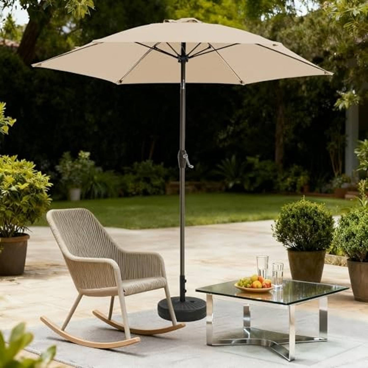Beige outdoor patio umbrella with open canopy and crank pole over garden furniture