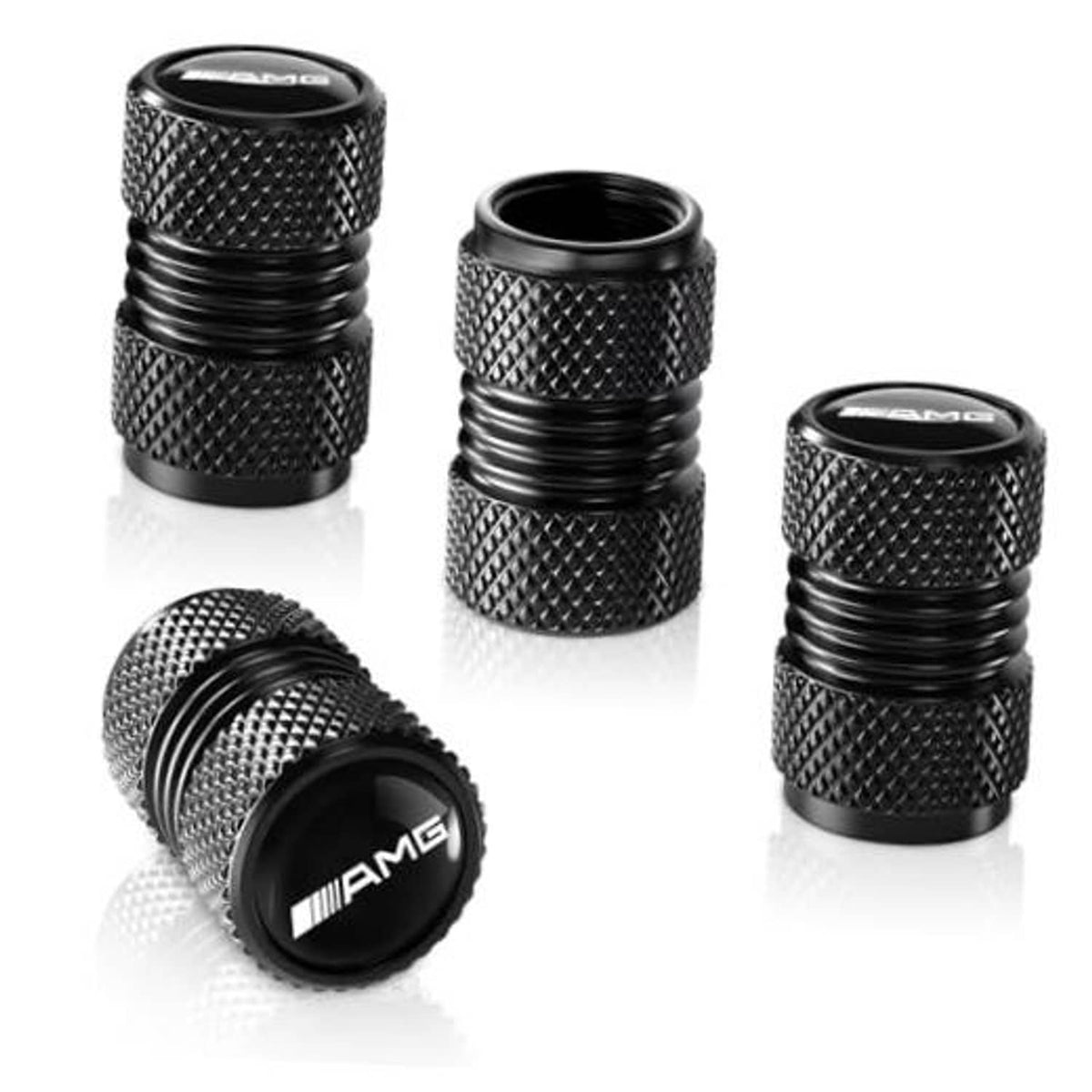Set of black textured tire valve stem caps with AMG logo, shown from multiple angles