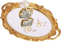 Antique-style gold oval decorative tray with clear crystal centerpiece and floral accents