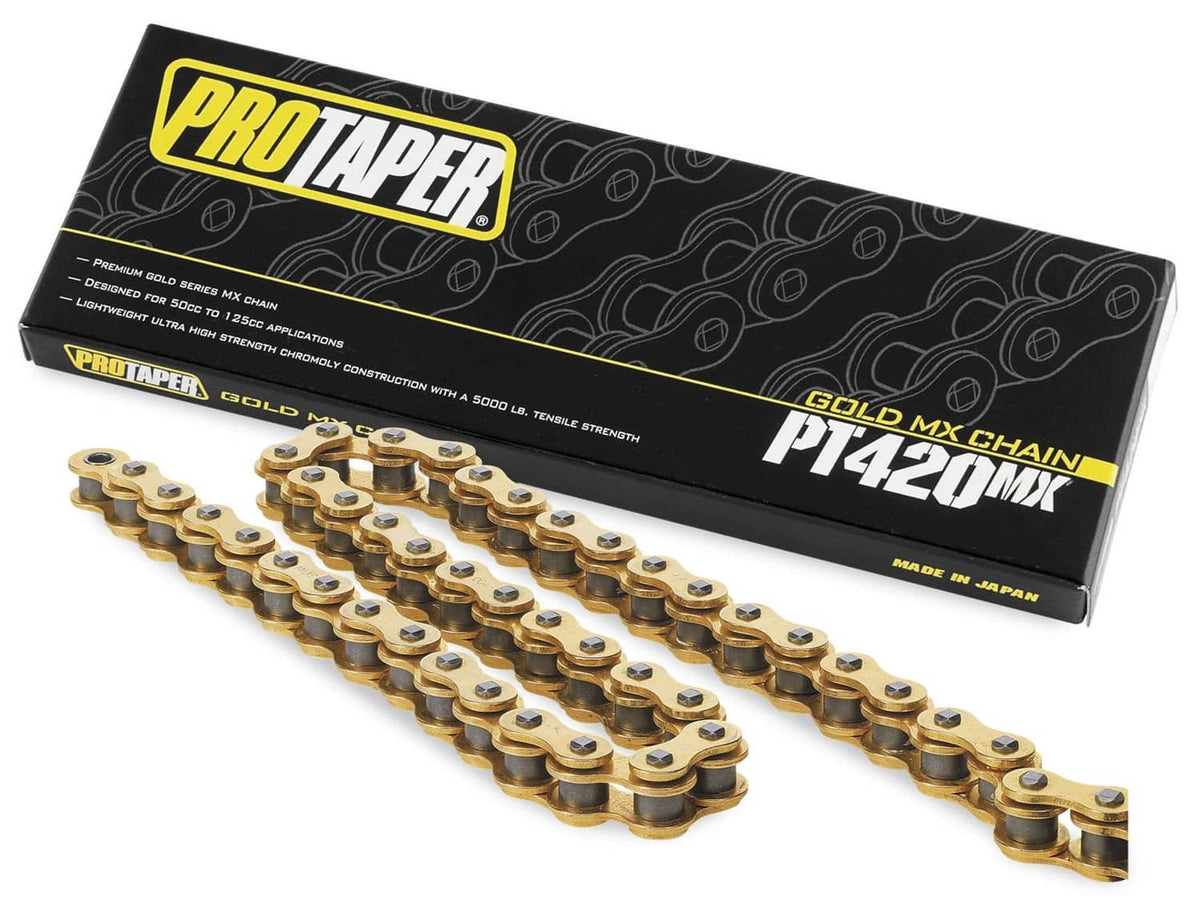 Gold motorcycle drive chain on display, with packaging box included