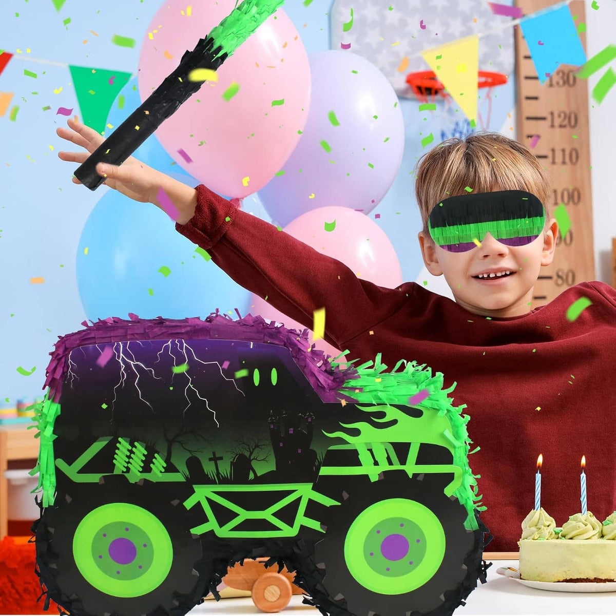 Green and purple monster truck pinata with stick and blindfold