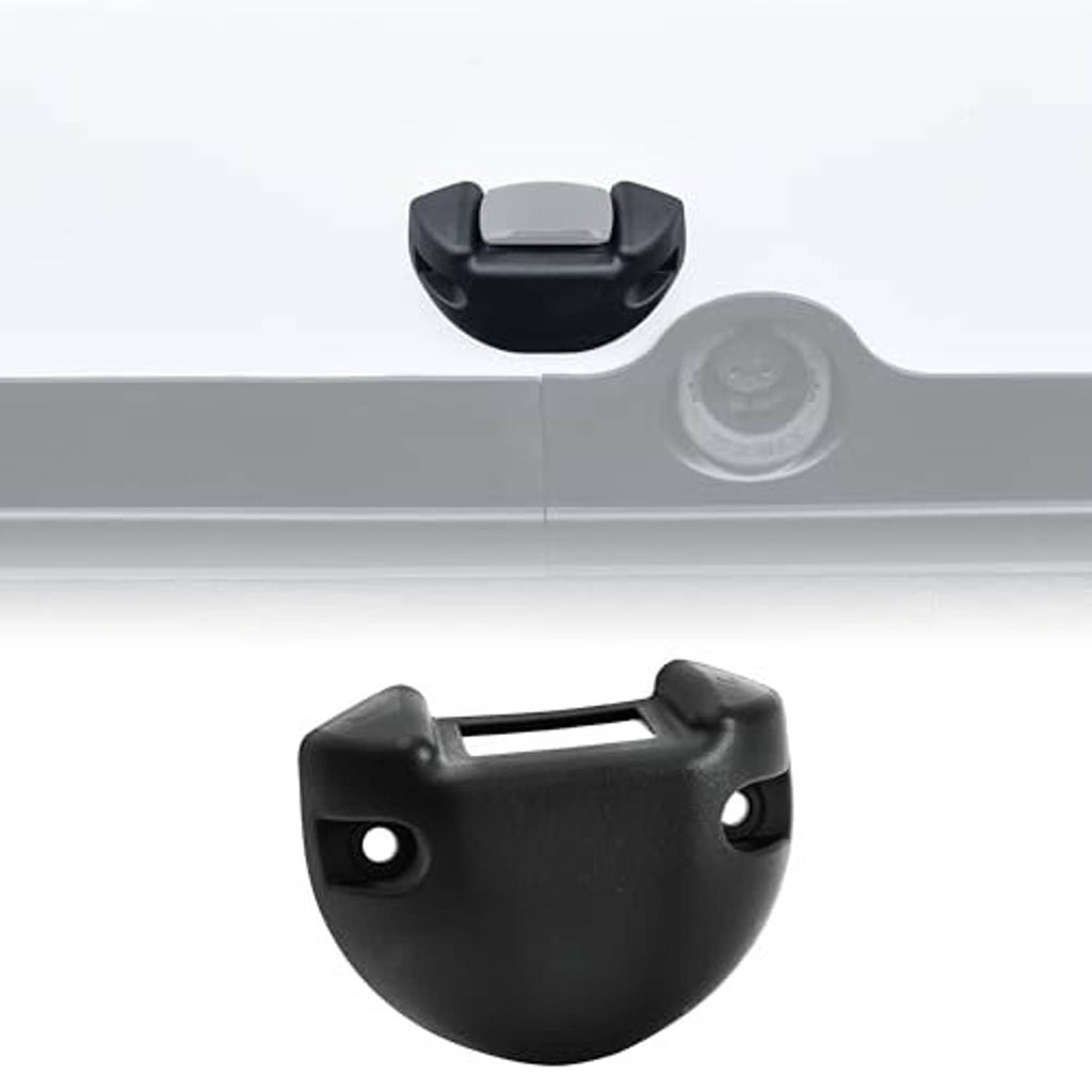 Black switch housing base cover mounted on a light gray panel edge