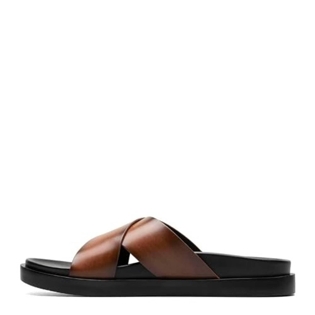Cognac brown slide sandal side view with wide X straps and thick black sole