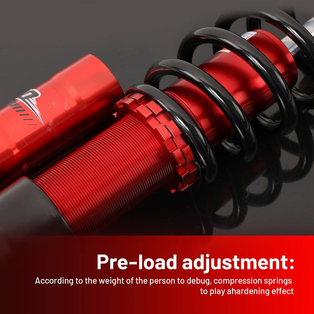 Close-up of red shock body and black coil spring with adjustment hardware