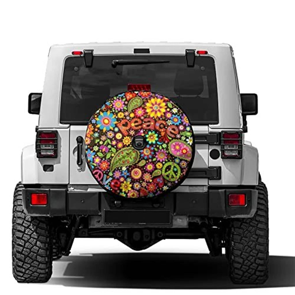 Spare tire cover showing colorful floral peace pattern with round backup camera hole
