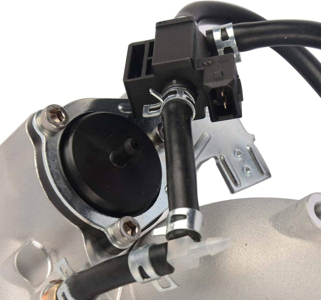 Turbocharger intake-side view with black electrical connector and circular inlet opening