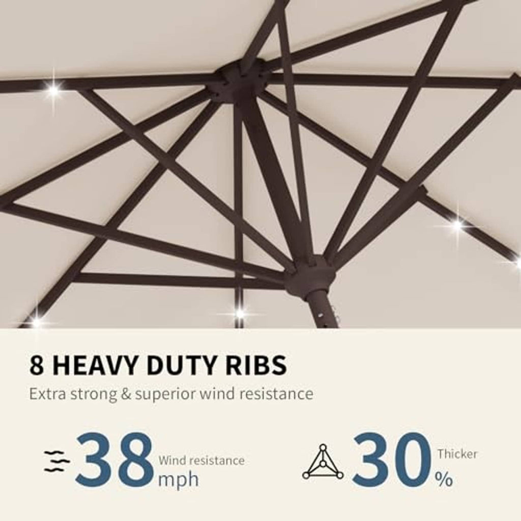 Beige patio umbrella canopy close-up with solar LED lights on black ribs