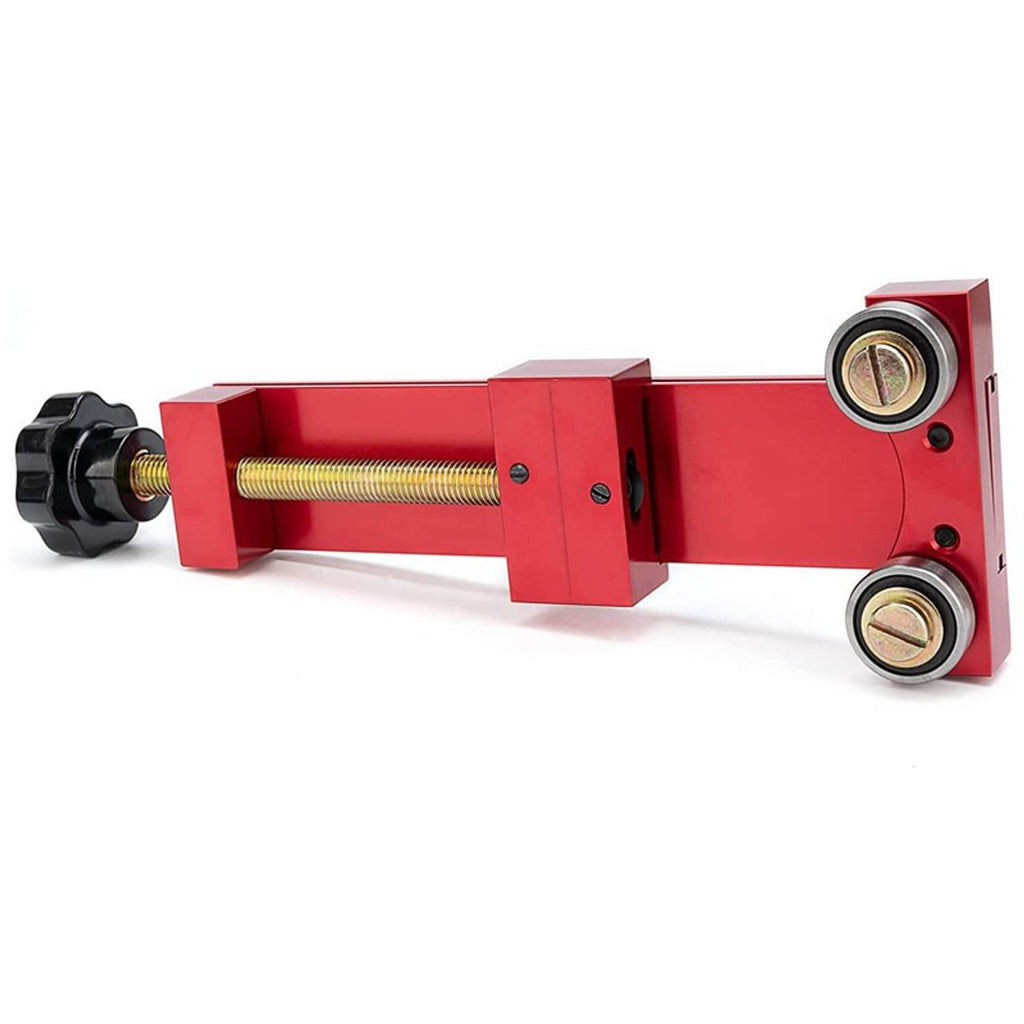 Red oil filter cutter tool with threaded rod and two roller bearings on metal frame