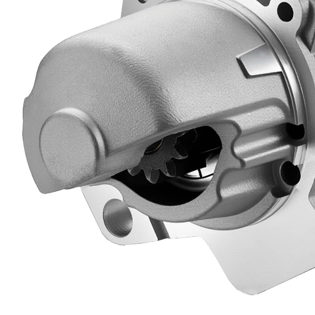 Starter motor front housing with silver body and black gear opening, close-up view.