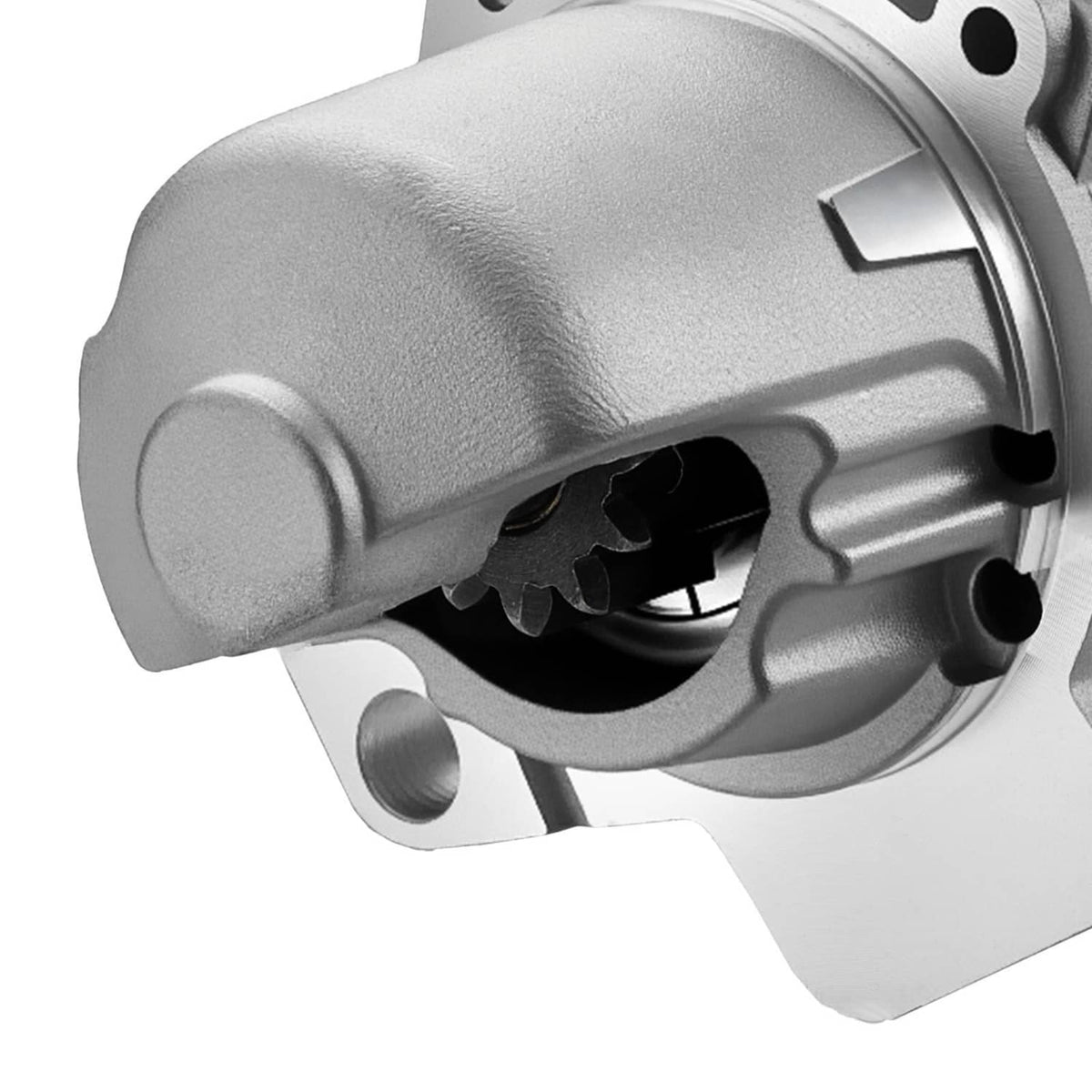 Starter motor front housing with silver body and black gear opening, close-up view.