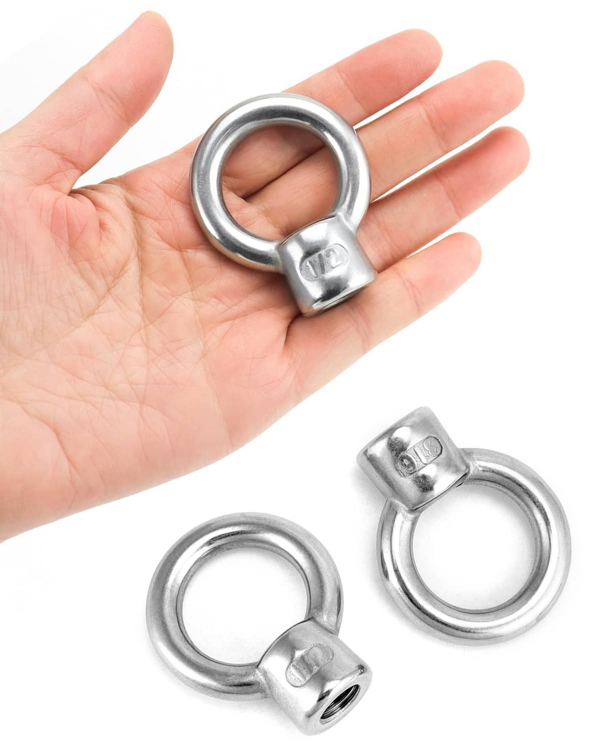 Stainless lifting eye nut on hand, 1/2 in UNC thread, includes two eye nuts