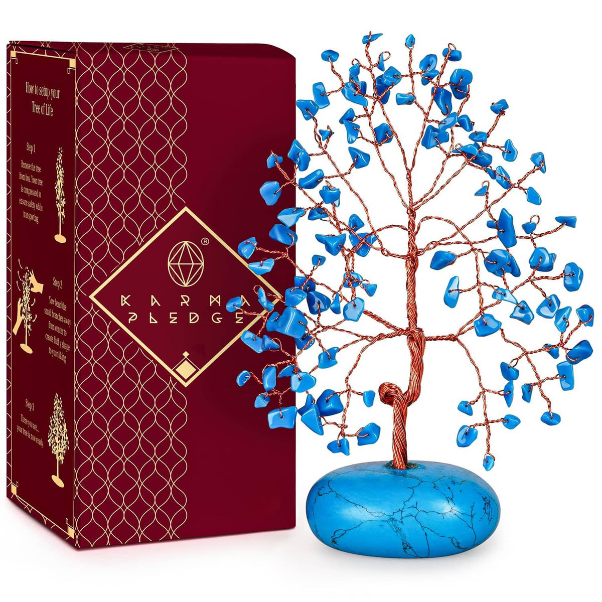 Turquoise crystal tree ornament with blue stone base, shown with retail box