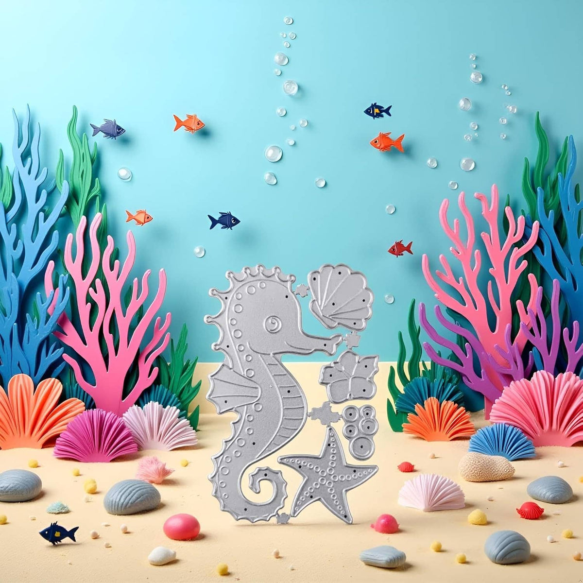Silver seahorse metal die-cut with shell and starfish shapes on aqua card