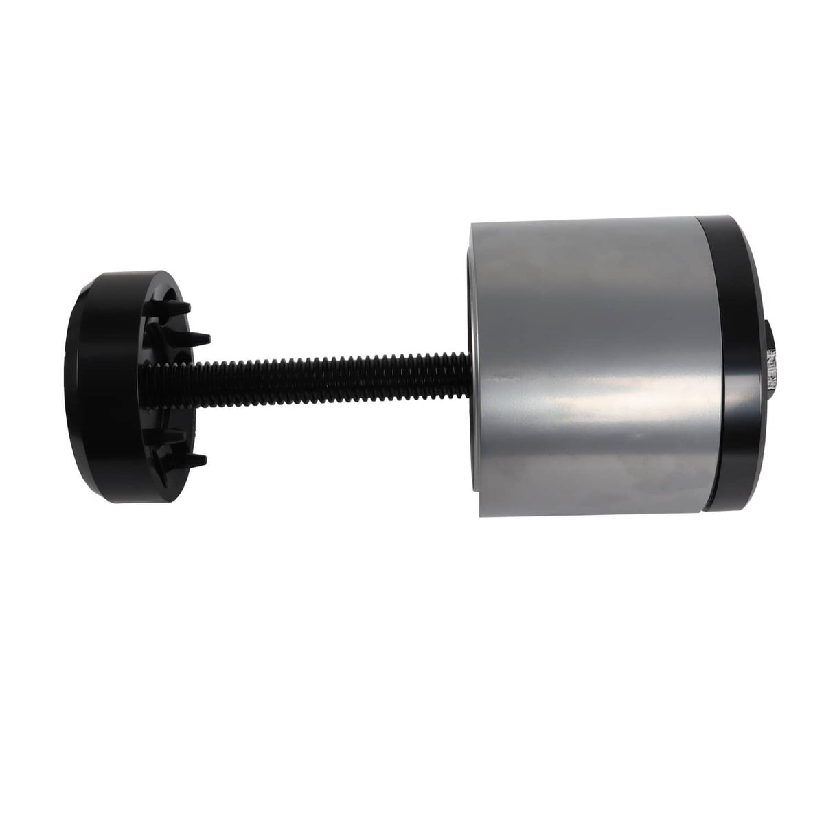 Bushing installation tool showing black plate, threaded rod, and silver cylinder sleeve