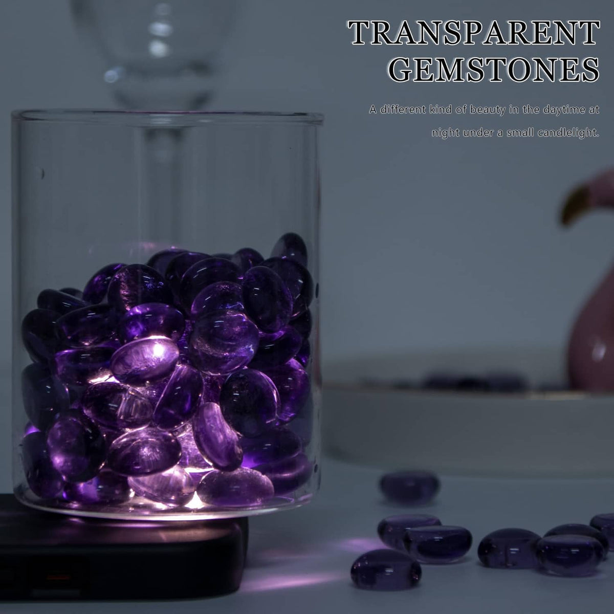 Purple glass gems inside a clear container, with individual stones visible