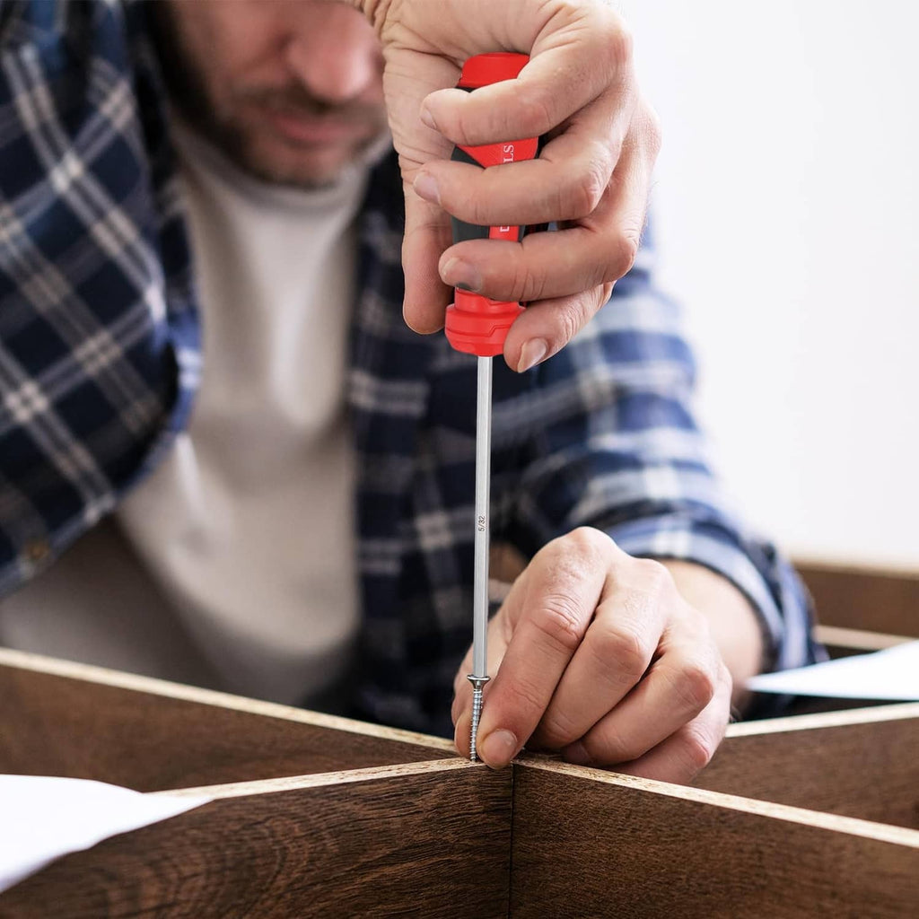 Hands using a hex screwdriver to drive a screw into a wooden board