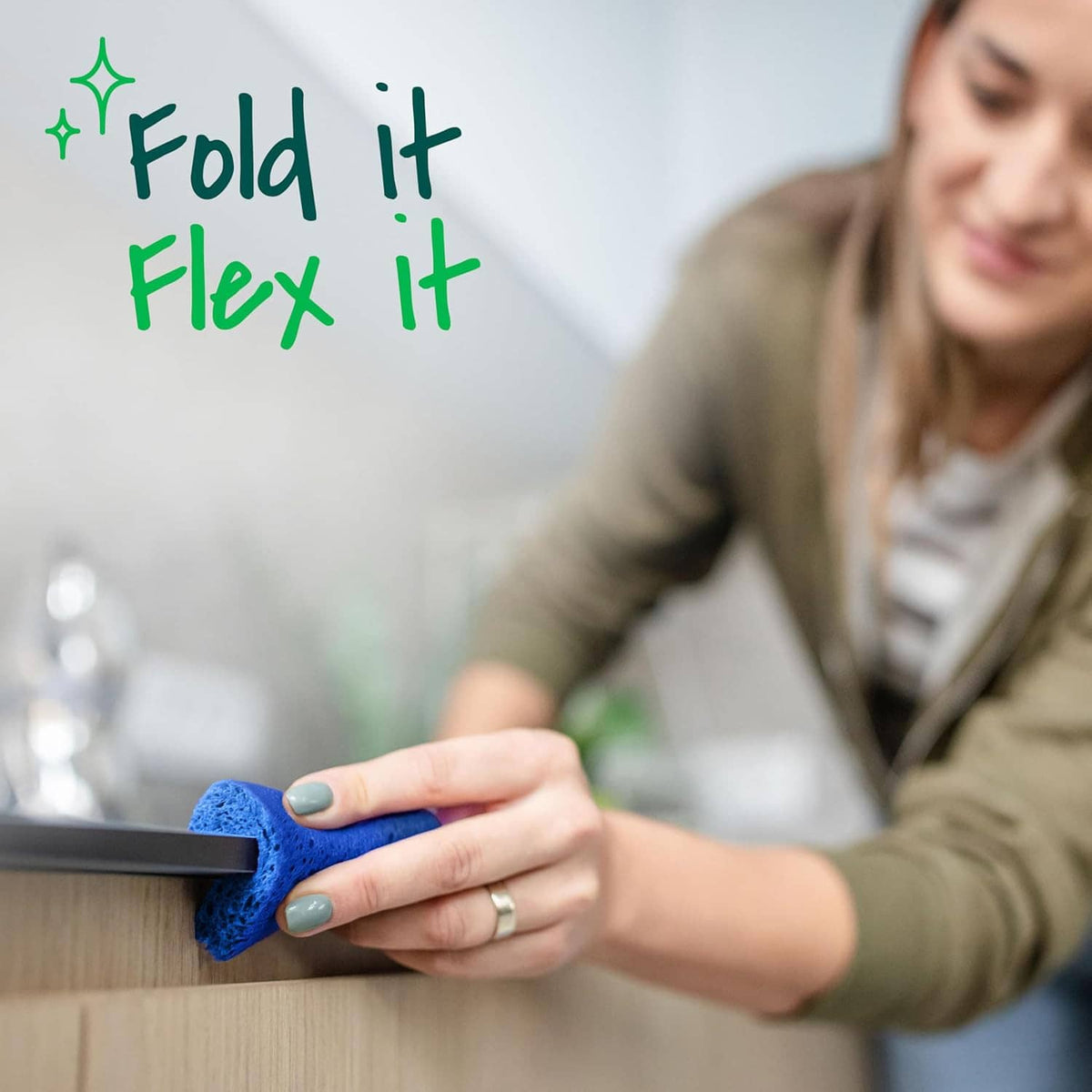 Blue flexible scrub sponge for everyday countertop and sink cleaning.