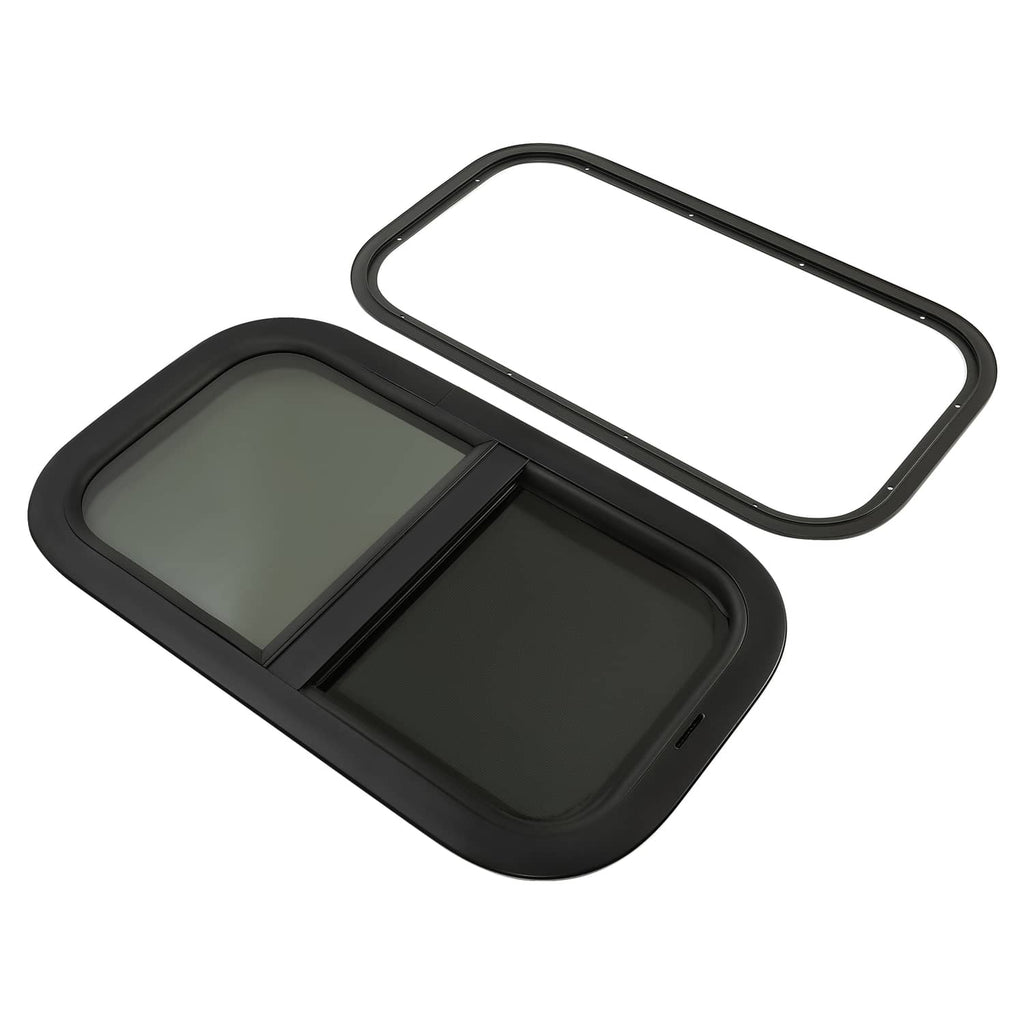 Tinted RV window kit with black frame and gasket seals, angled view of glass panels