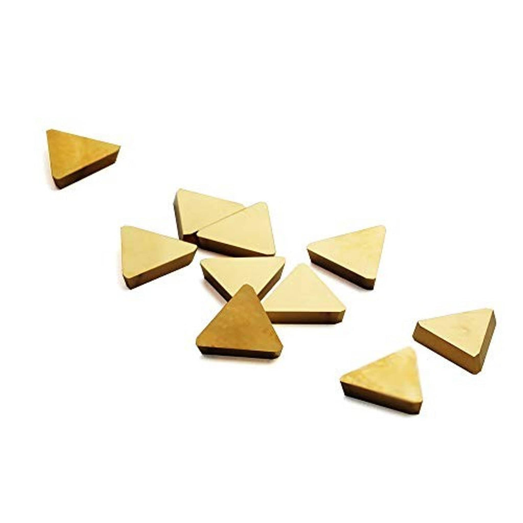 Triangular carbide milling inserts, gold-toned coated tips, scattered