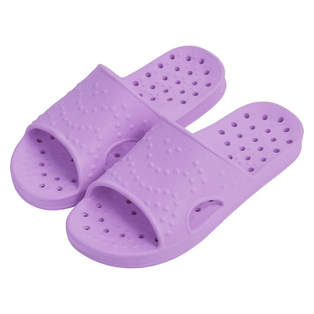Purple pair of shower slide sandals with perforated, textured footbeds.