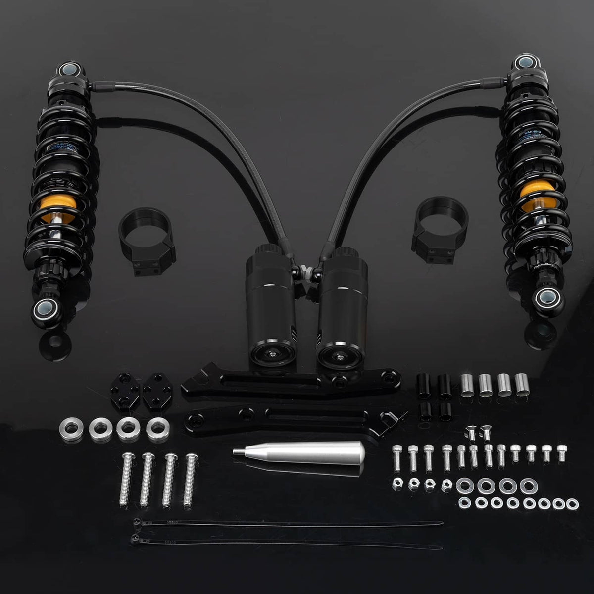 Black remote reservoir suspension shocks set with yellow adjuster rings and mounting hardware