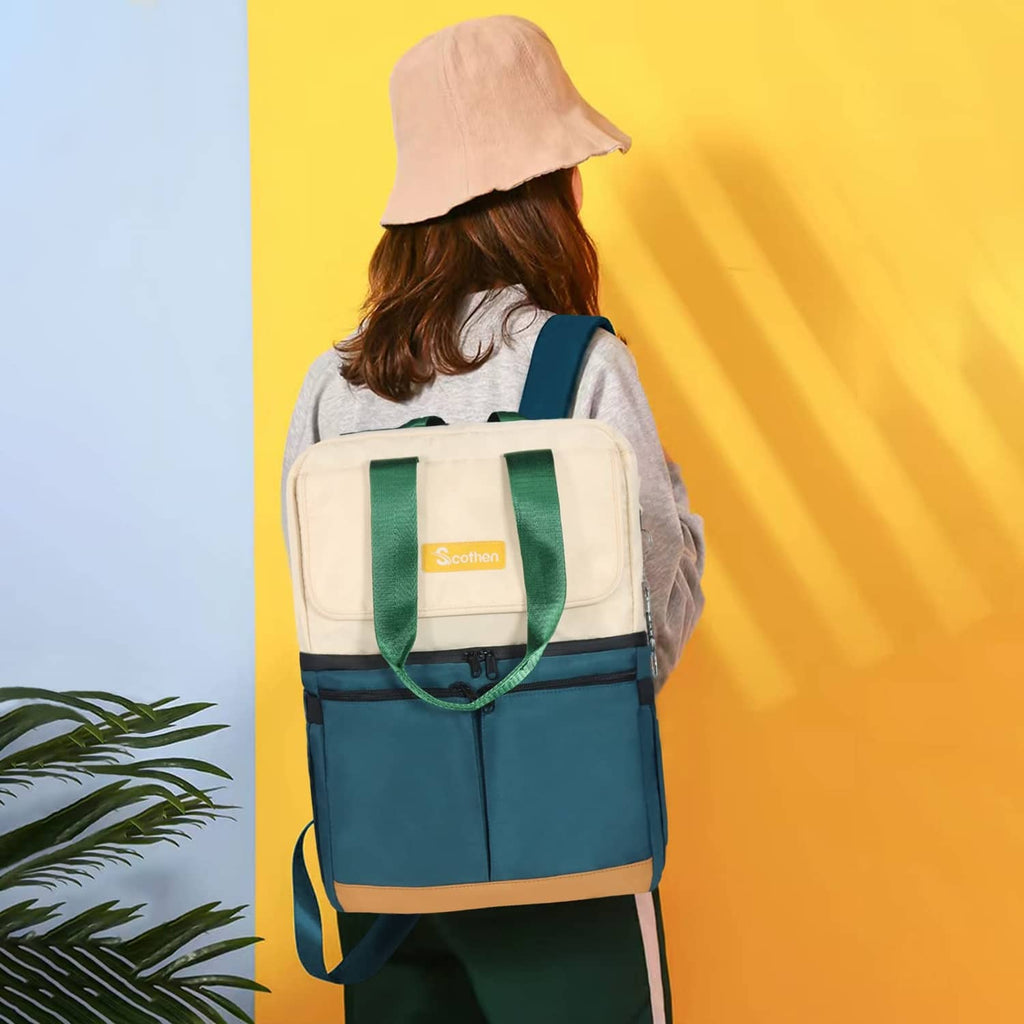 Person wearing a green and cream insulated backpack cooler with front logo patch